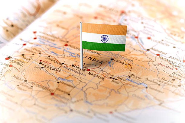 The flag of India pinned on the map. Horizontal orientation. Macro photography.